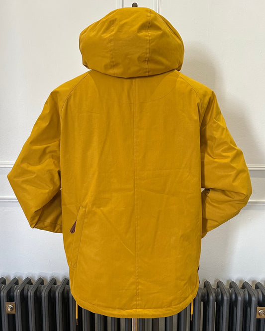Supermoon Field Parka in Arrowood yellow, product image 2. Showing back view with back pocket