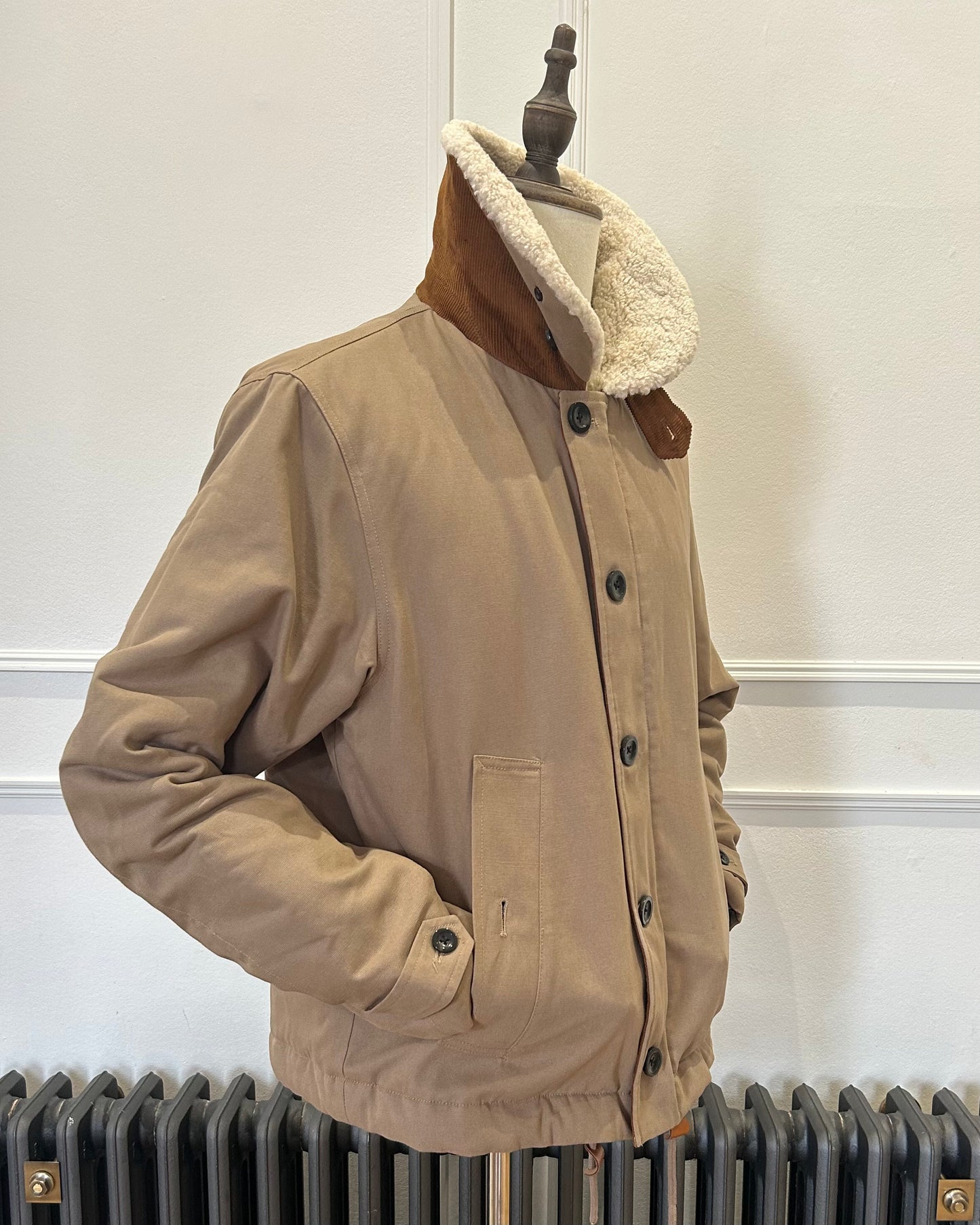 Supermoon Deck Jacket in cotton duck canvas, product image 3. Showing 3/4 view with collar worn up and hand in pockets 
