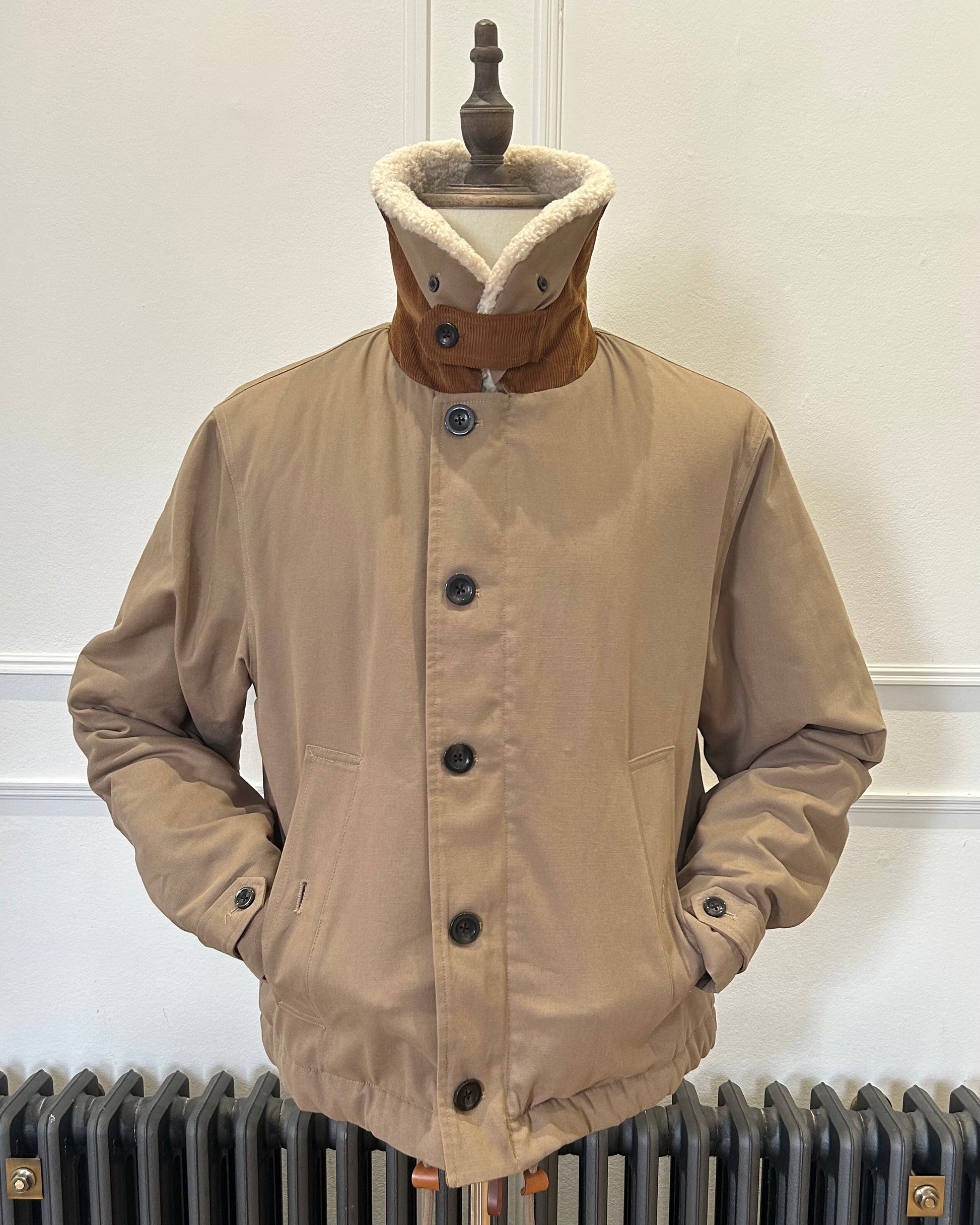 Supermoon Deck Jacket in cotton duck canvas, product image 2. Showing front view with collar worn turned up and hand in pocket 
