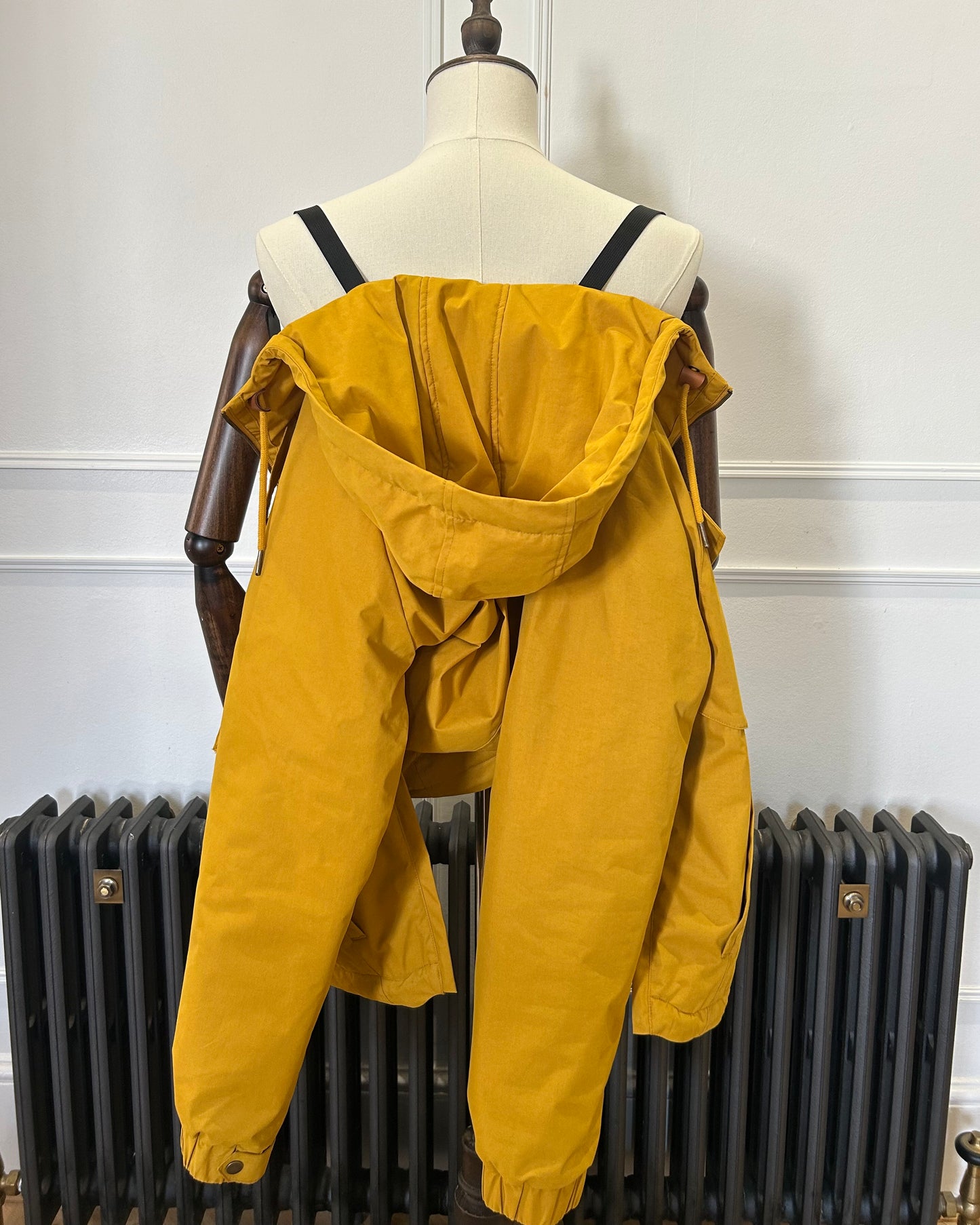 Supermoon Field Parka in Arrowood yellow, product image 5. Showing back view worn with the shoulder straps.