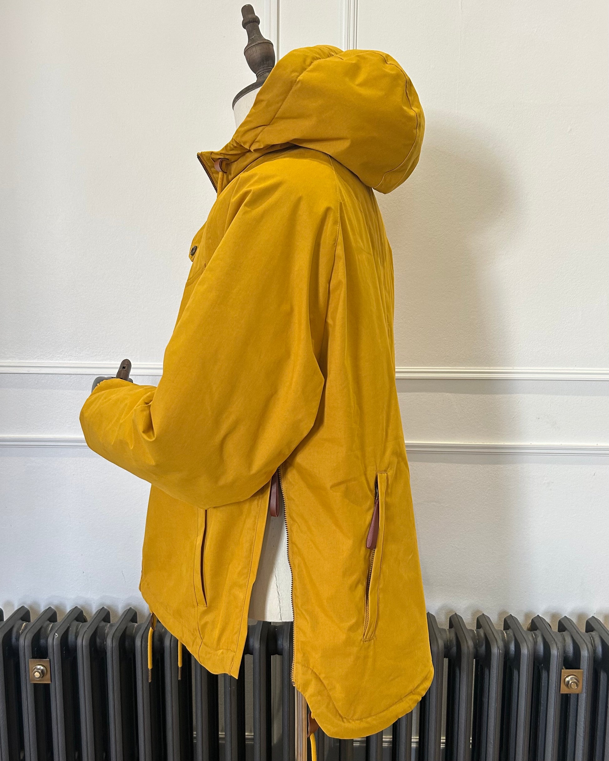 Supermoon Field Parka in Arrowood yellow, product image 3. Showing side view with side zippers open 
