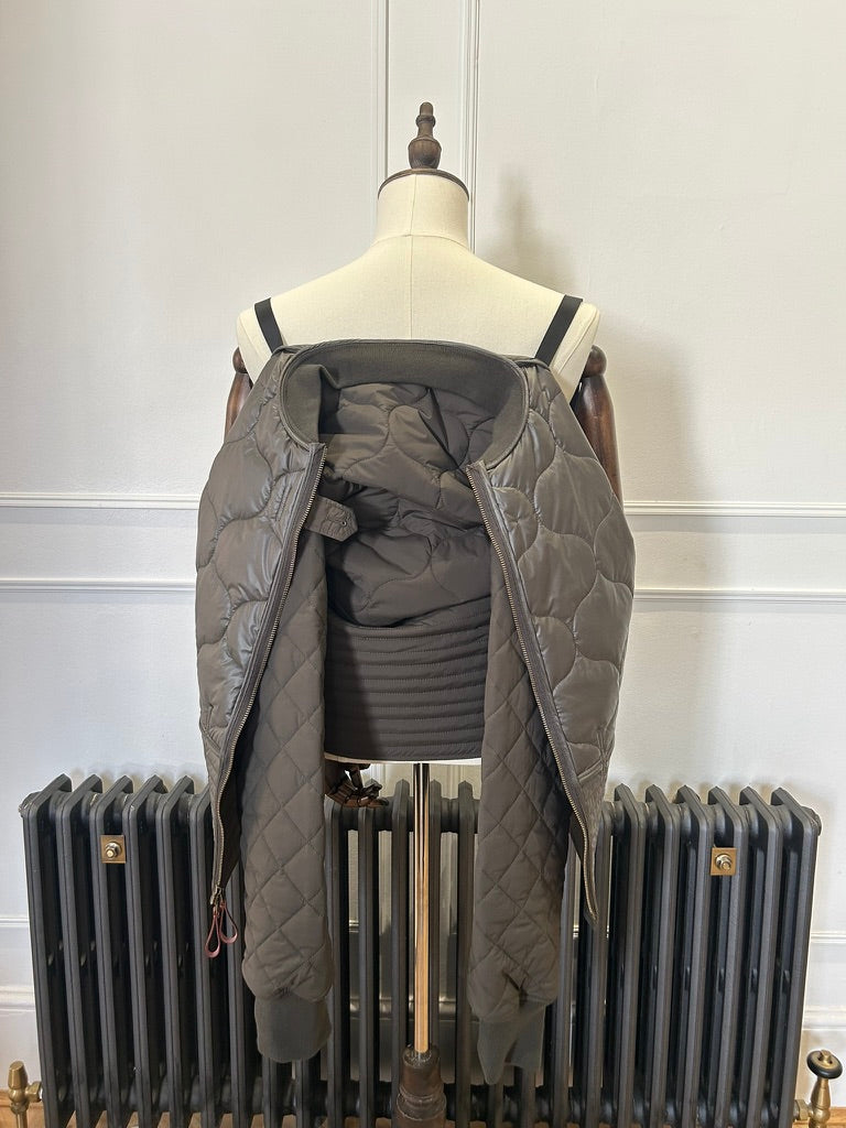 Supermoon Field Liner quilted nylon jacket, product image 6. Showing jacket being worn with the shoulder straps 