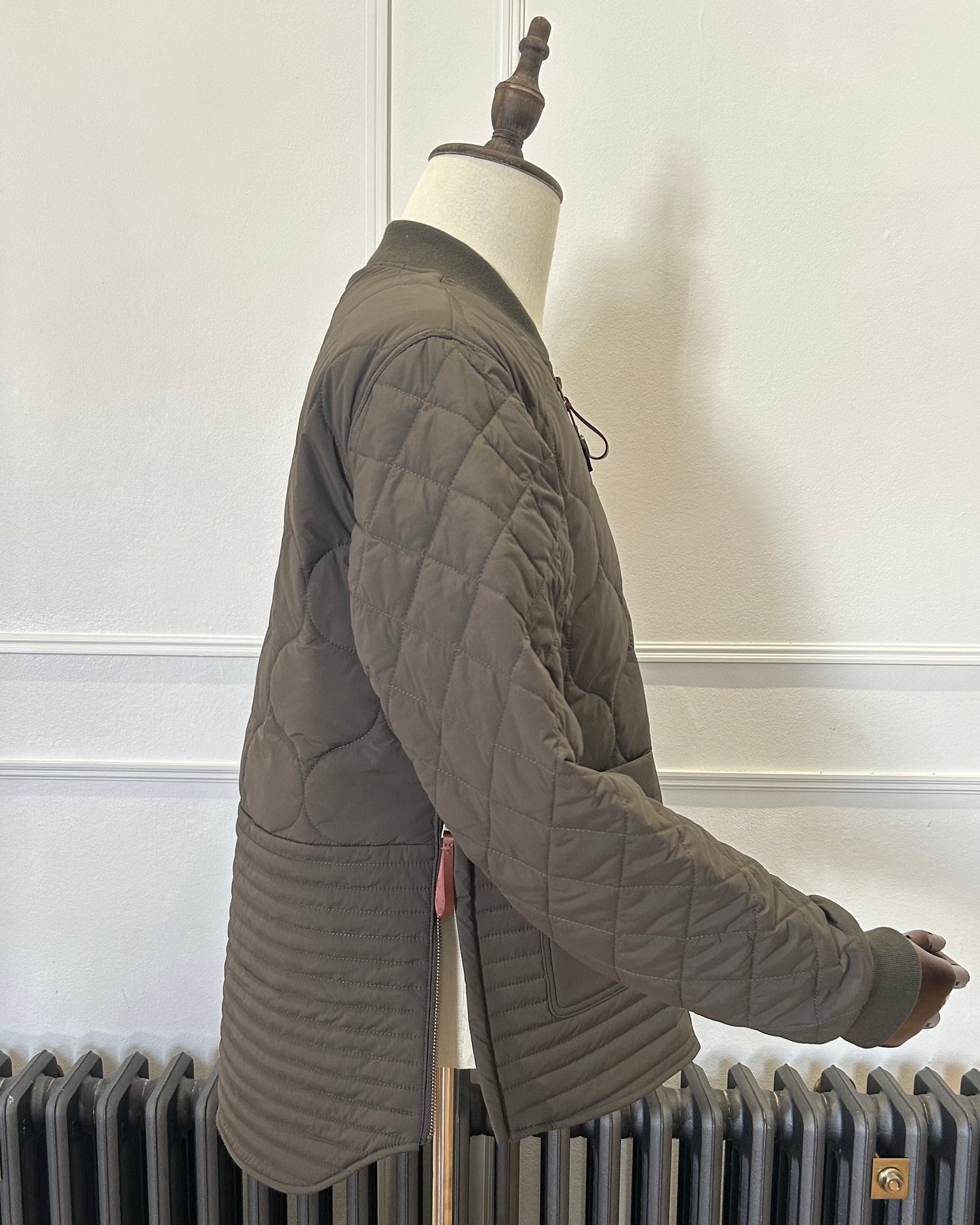 Supermoon Field Liner quilted nylon jacket, product image 3. Showing side view with side zips open 